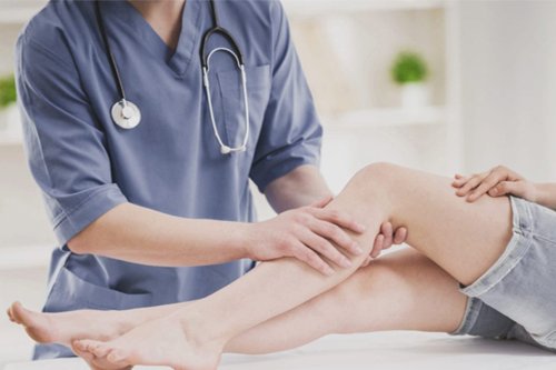 Orthopedic Doctor check Patient's legs crack